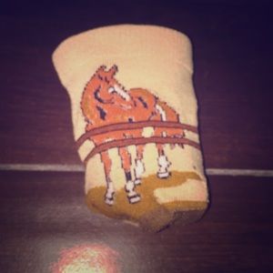 These are socks that have a horse on the front